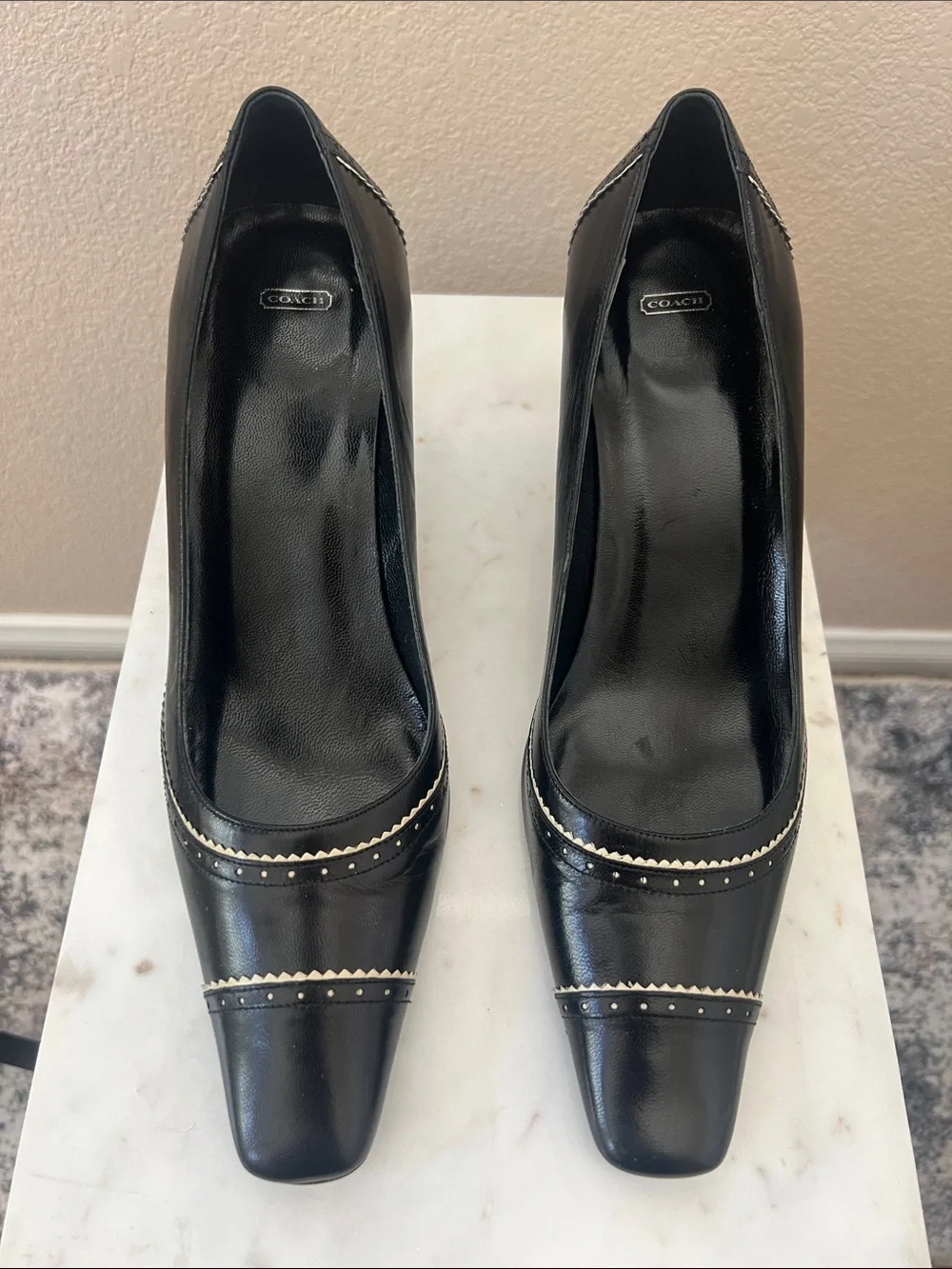 Coach Black Leather Pointed Toe Heels with Metallic Accent